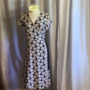 Polka dotted wrap style dress in small by TOUCHÉ